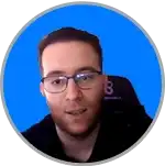 Smiling day trader wearing spectacles on blue background